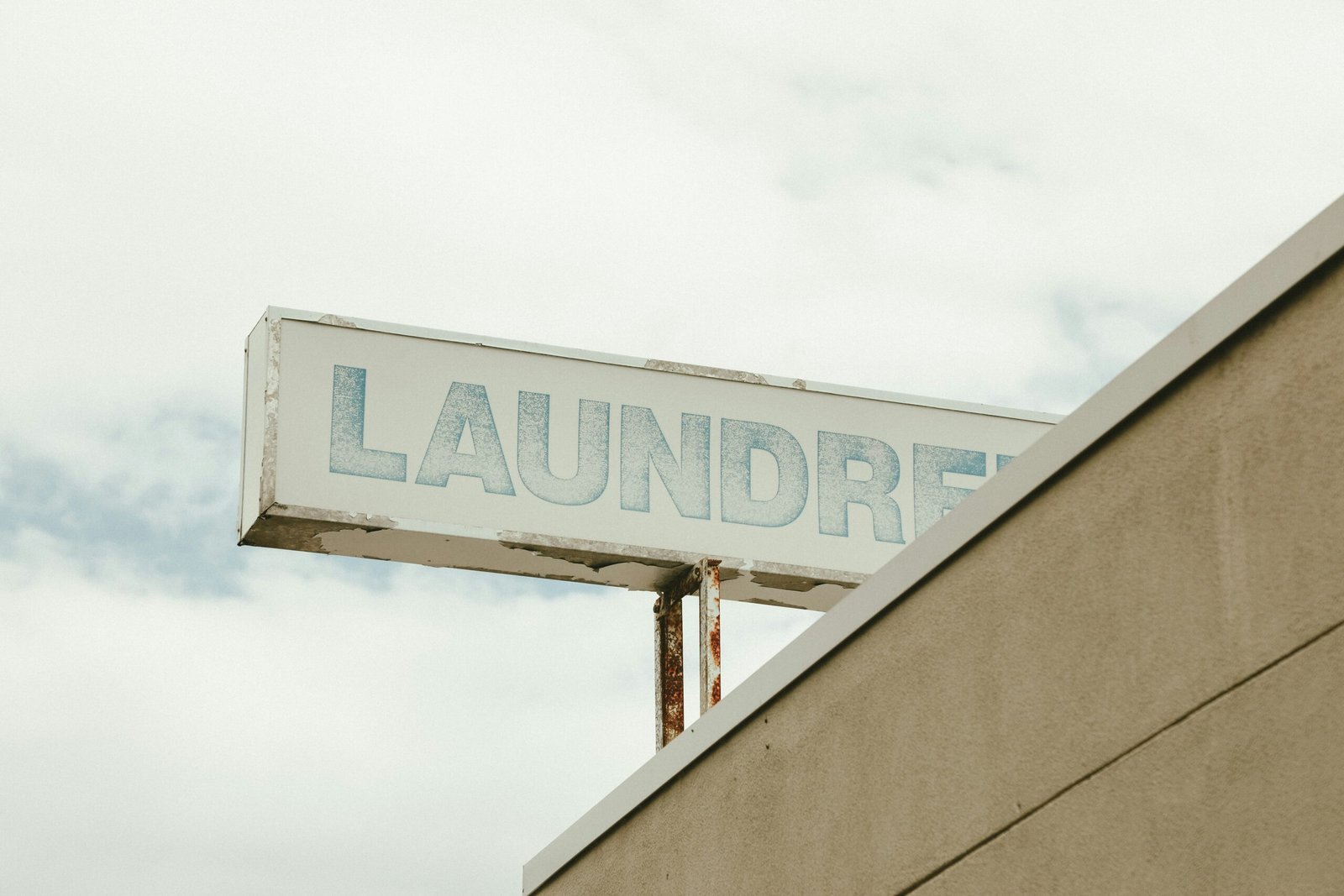 a street sign on top of a building